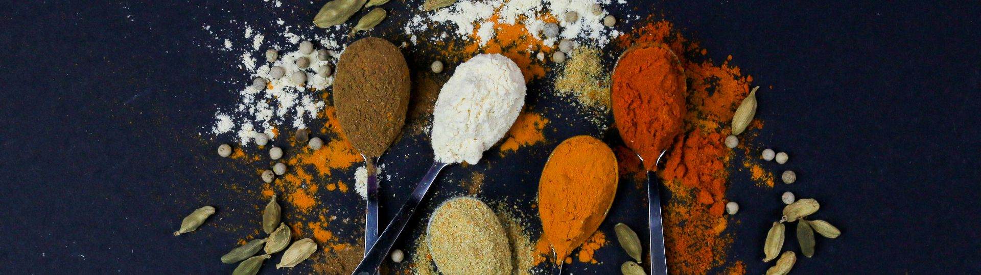 A selection of ground and raw spices.