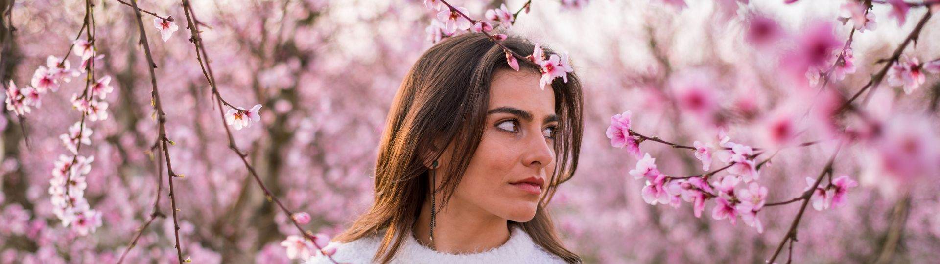 Skintentionals woman in peach flowers