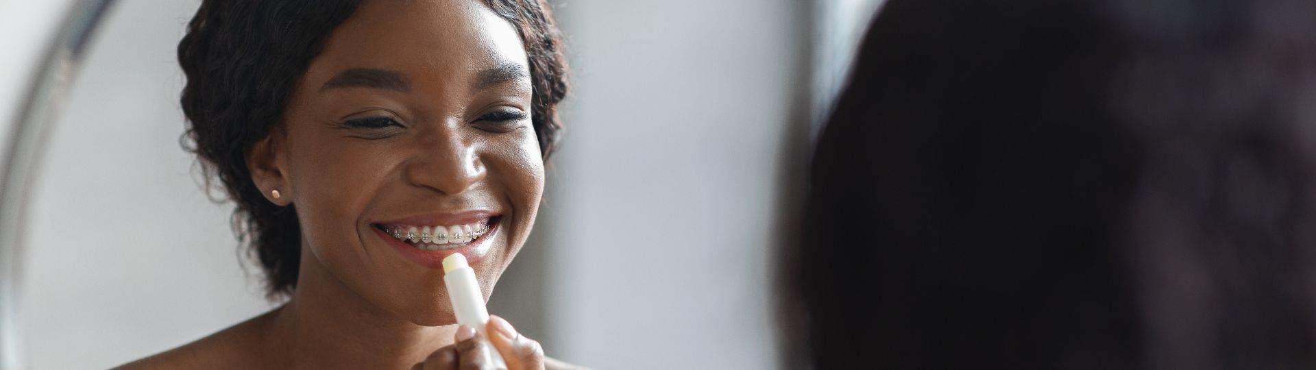 Good mood girl with an oil-based lipstick